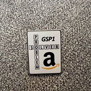 Amazon GSP1 Problem Solver Enamel Pin - White, Black, Gold